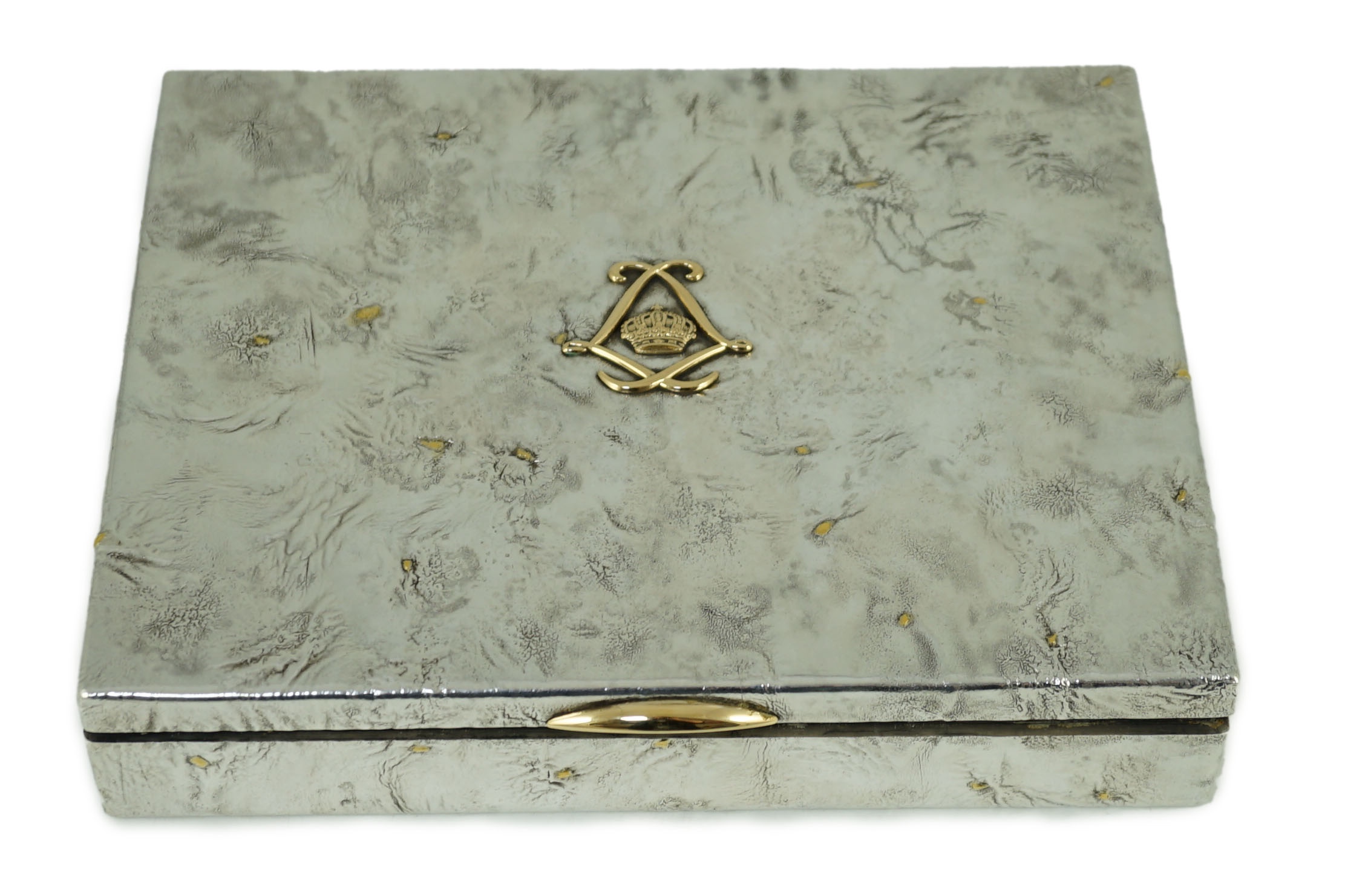 A mid 20th century gold mounted samorodok technique silver rectangular box, by Jacques Cartier, the lid interior engraved with the ' Voyage au Congo du 20 Fevrier au 14 Avril, 1957'